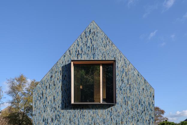 Vibrant tile facade enlivens new residence in Schoorl